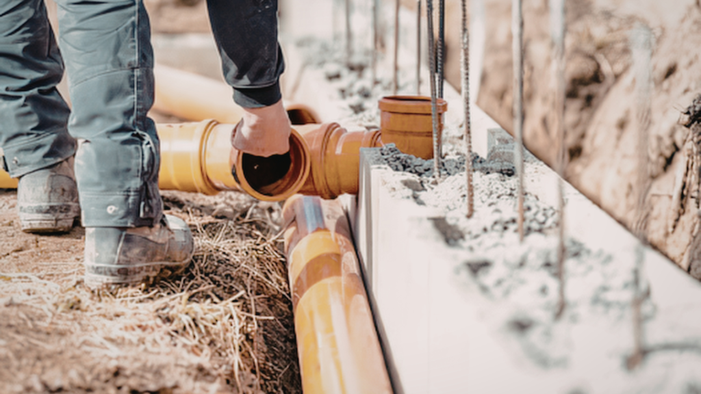 Contractor Installing Underground Drainage System